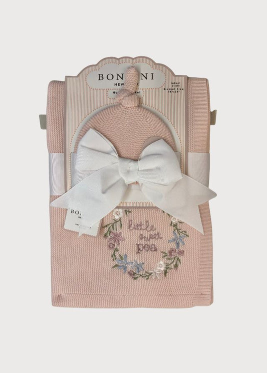 Cobija tejida rosa con gorro